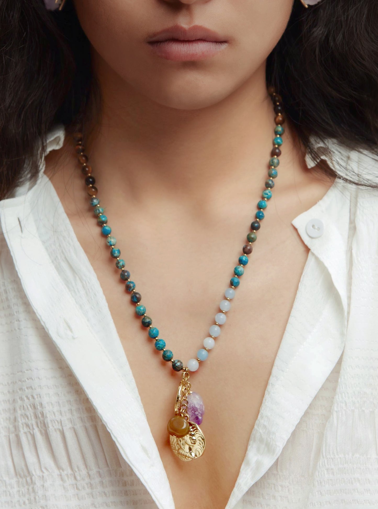 Lifestyle shot of the Huatuo Stone Tiger's Eye Amethyst Sweater Chain Necklace worn, perfect for an earthy, grounding look with amethyst energy