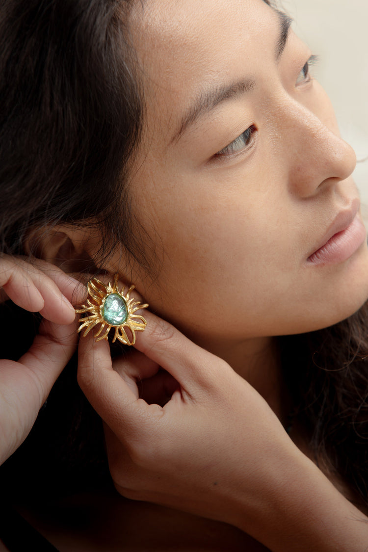 Turquoise Sunflower Golden Vintage Stud Earrings, showcasing a vibrant turquoise stone set in a golden sunflower design