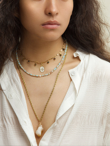 Styling inspiration featuring the Yellow Tiger's Eye Star Charm Choker Necklace, paired with complementary accessories to enhance its bohemian and spiritual vibe