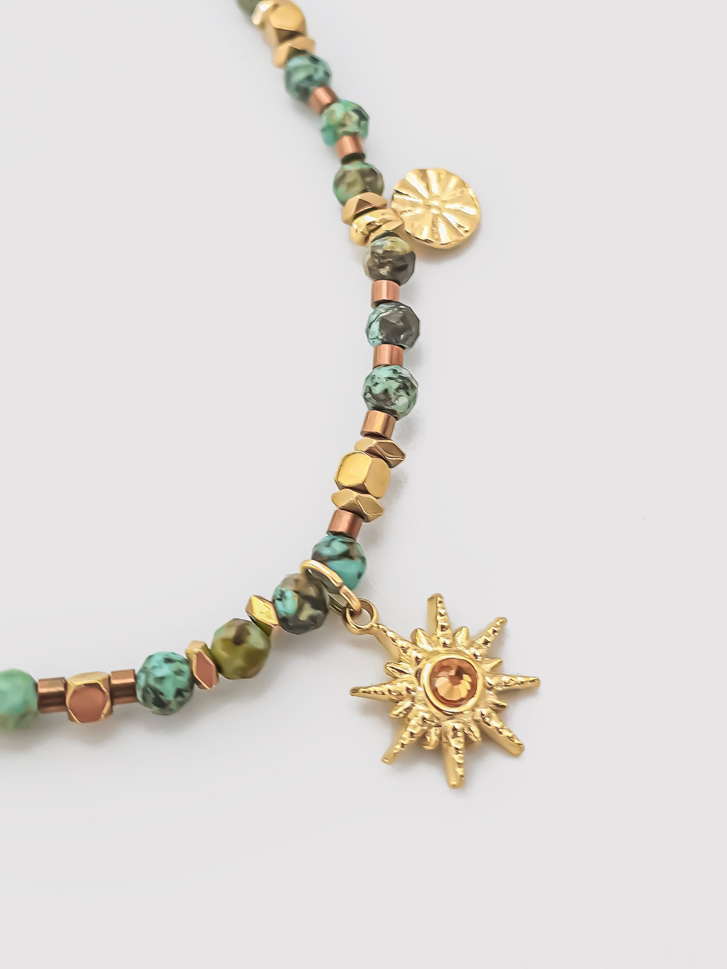 Close-up of the African Turquoise Vintage Sun Necklace, highlighting the sun pendant and detailed craftsmanship