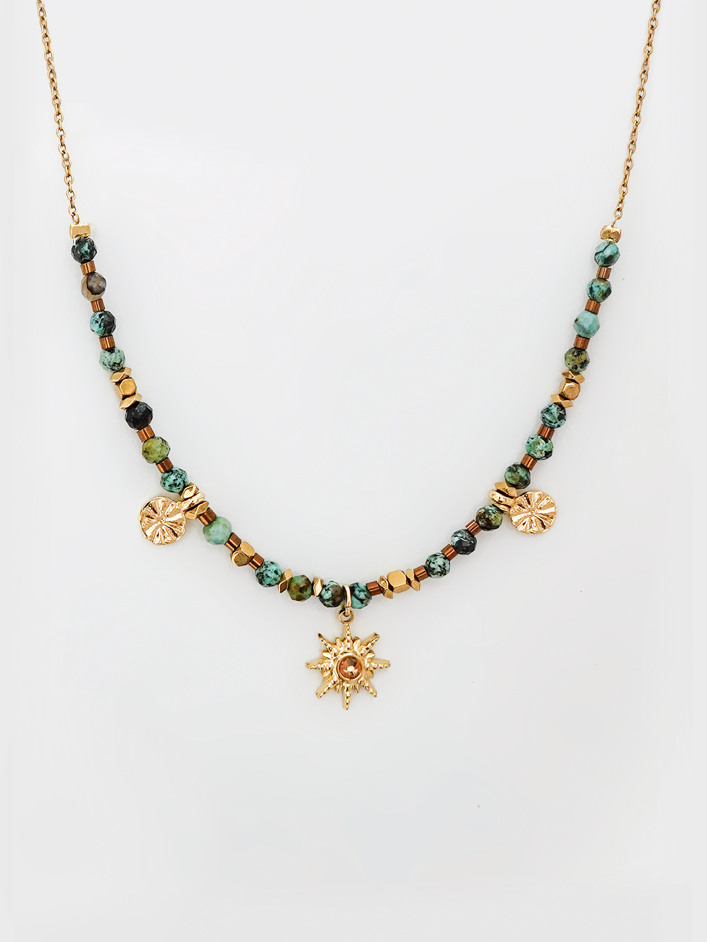 A front view of the African Turquoise Vintage Sun Necklace, featuring a bold sun pendant with vibrant African turquoise beads and a vintage-inspired design