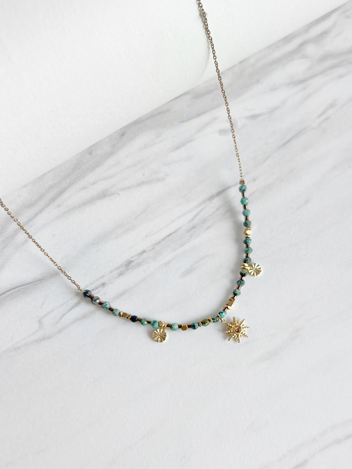 African Turquoise Vintage Sun Necklace showing the intricate sun charm and natural African turquoise beads