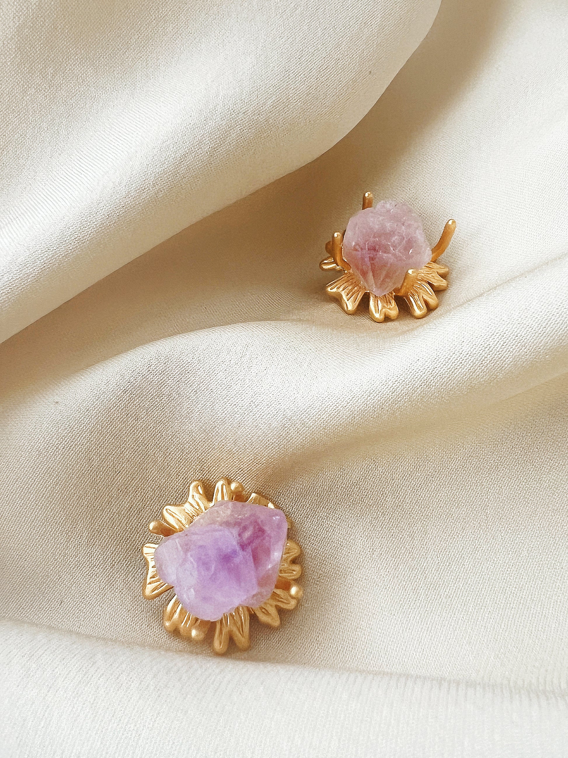 Close-up of the Amethyst Sunflower Golden Stud Earrings, capturing the gold finish and the radiating sunflower petals around the amethyst stones