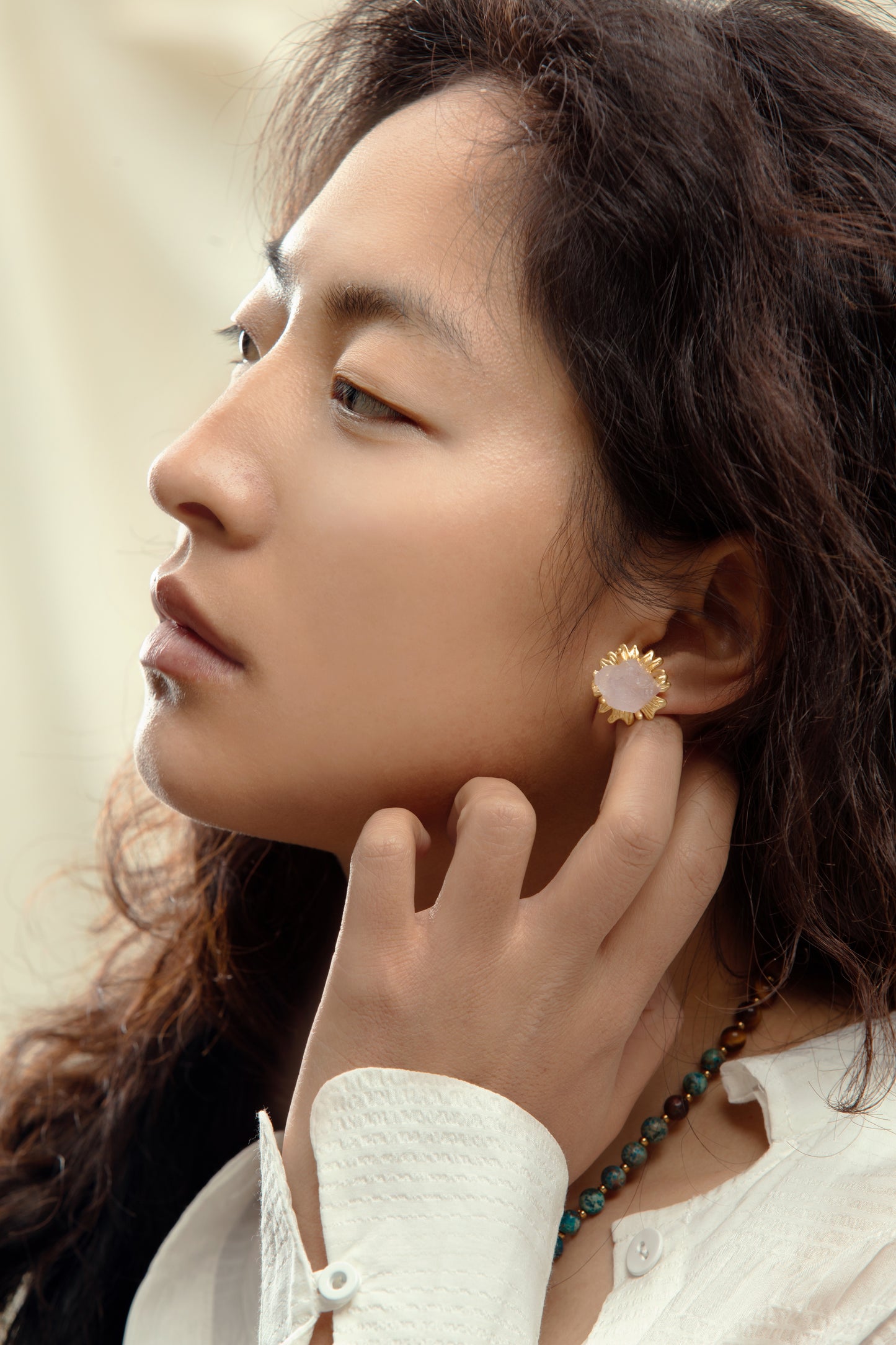 Lifestyle shot of the Amethyst Sunflower Golden Stud Earrings worn, radiating positivity and energy with the vibrant amethyst and gold design