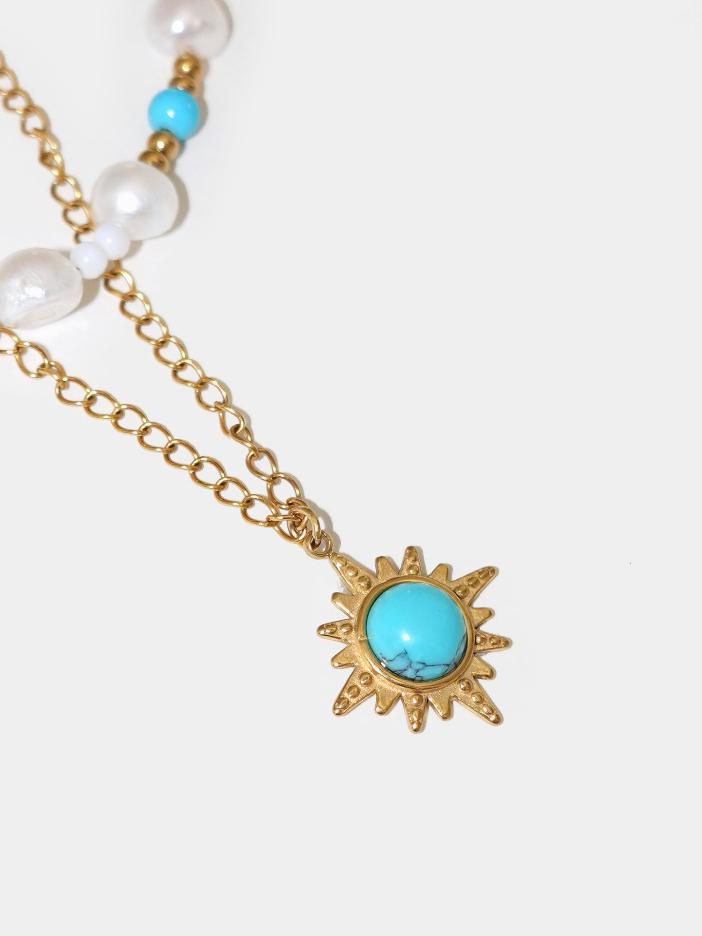 Close-up of the Blue Turquoise Pearl Layered Necklace, capturing the smoothness of the turquoise stones and the shine of the freshwater pearls