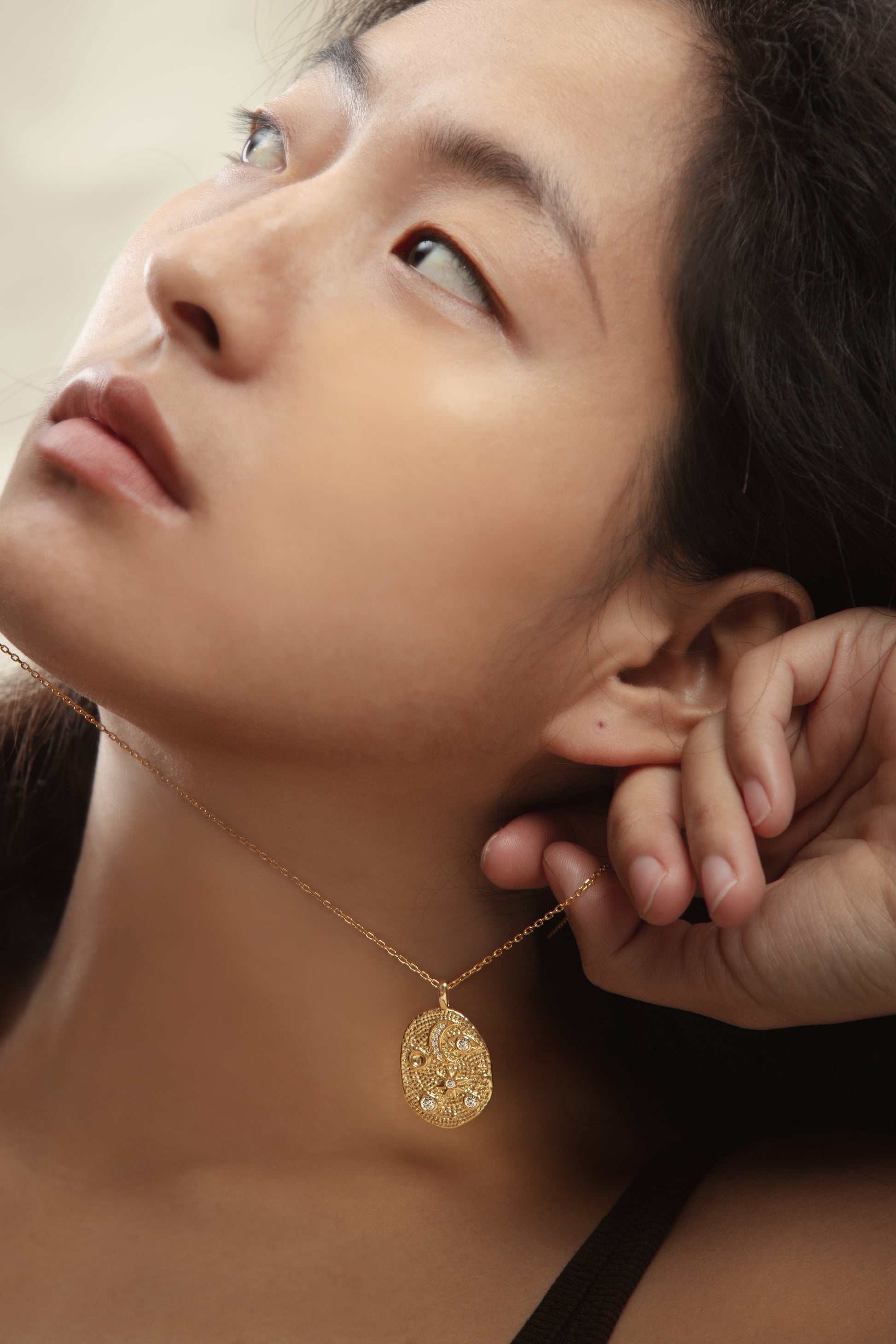 Lifestyle shot of the Natural Spiritual Symbols Charm Golden Necklace worn with spiritual symbols, perfect for mindful living and spiritual awareness