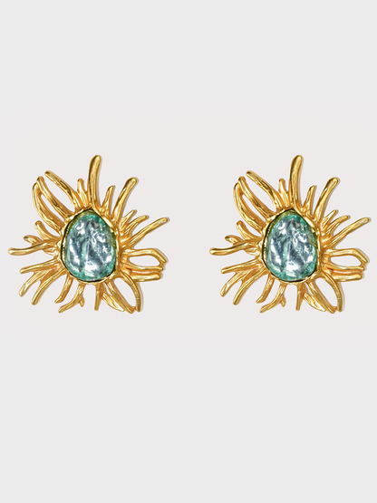 A front view of the Turquoise Sunflower Golden Vintage Stud Earrings, showcasing a vibrant turquoise stone set in a golden sunflower design